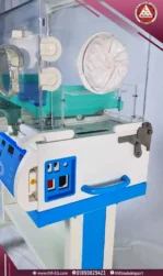 Side view of AMS 2M-24 neonatal incubator ports panel in white and blue design