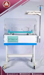 Rear angle view of AMS 2M-24 neonatal incubator in white and blue with wheels and transparent glass cover