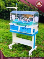 Real image of AMS 2M-24 neonatal incubator in white and blue with wheels and digital display for precise temperature control