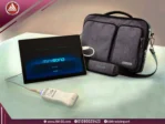 A realistic image of a black Mini Sono ultrasound machine with one white probe and a gray carrying case.