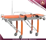 Orange Saikang ambulance trolley in flat position with detachable stretcher, fluid-resistant mattress, 4 wheels with brakes