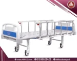 Saikang 2-function manual hospital bed in flat position, dual cranks, IV pole, safety rails, sturdy white frame, 4 wheels