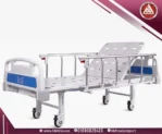 Saikang 2-function manual hospital bed, backrest raised, dual cranks, IV pole, safety rails, white frame, 4 wheels