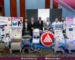 AM Company team displays white digital anesthesia machines, white and blue ventilators with touch screens, and a portable EKG machine on a white trolley with a black ultrasound.