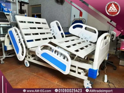 Electric 3-function hospital bed with remote, low ABS side rails, without a mattress, white-blue frame, and four wheels with bumpers