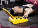 Automated External Defibrillator (AED) being used inside a gym to rescue a person after sudden cardiac arrest during exercise, with electrodes attached to the patient’s chest.