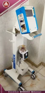 Side-angle natural view of the MEK MTV1000 ventilator, made in Korea, 7-inch touch screen, white-blue design with 4 wheels